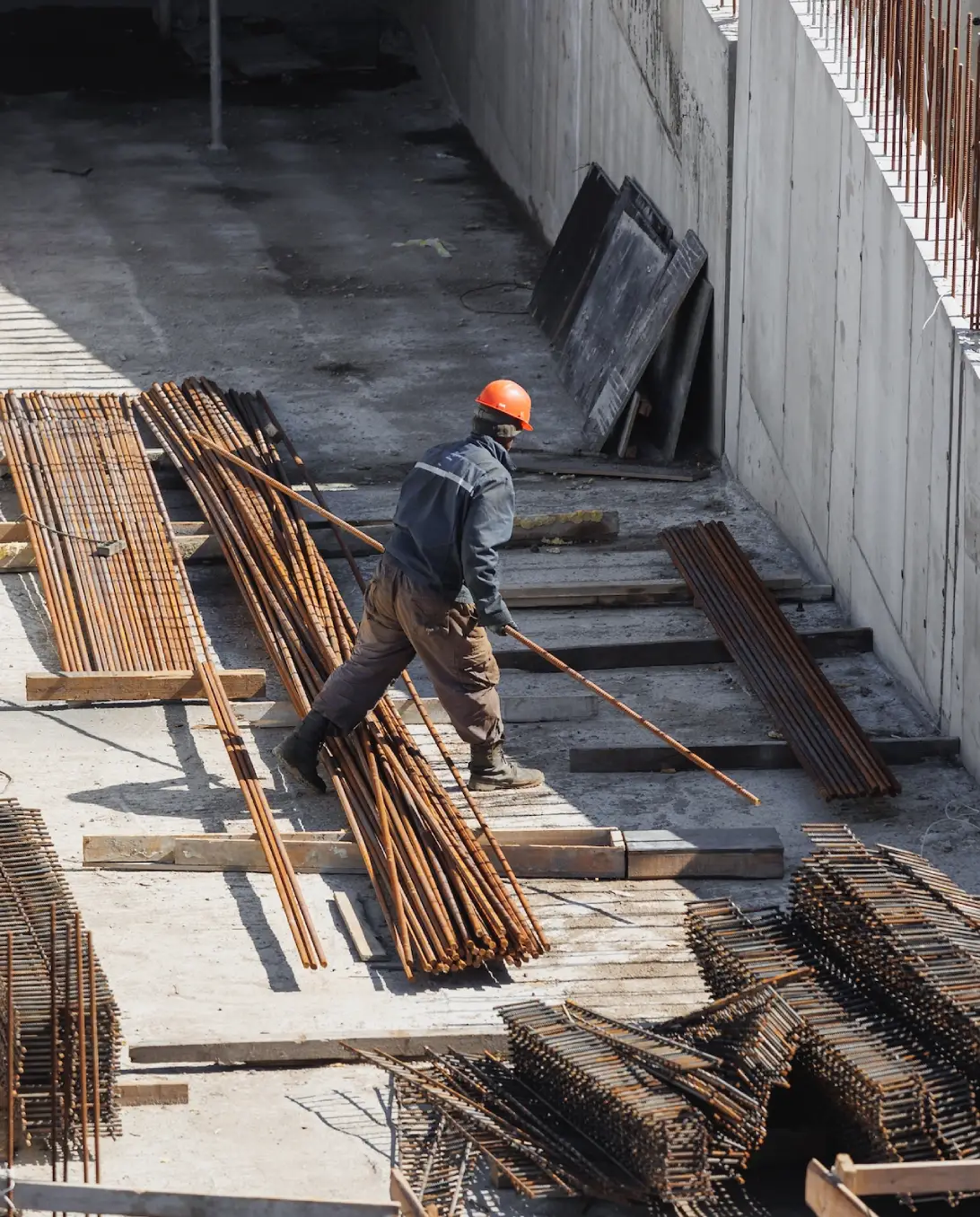 construction engineer in an orange helmet is worki utc.webp